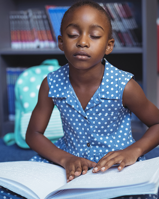 Girl Reading Braille