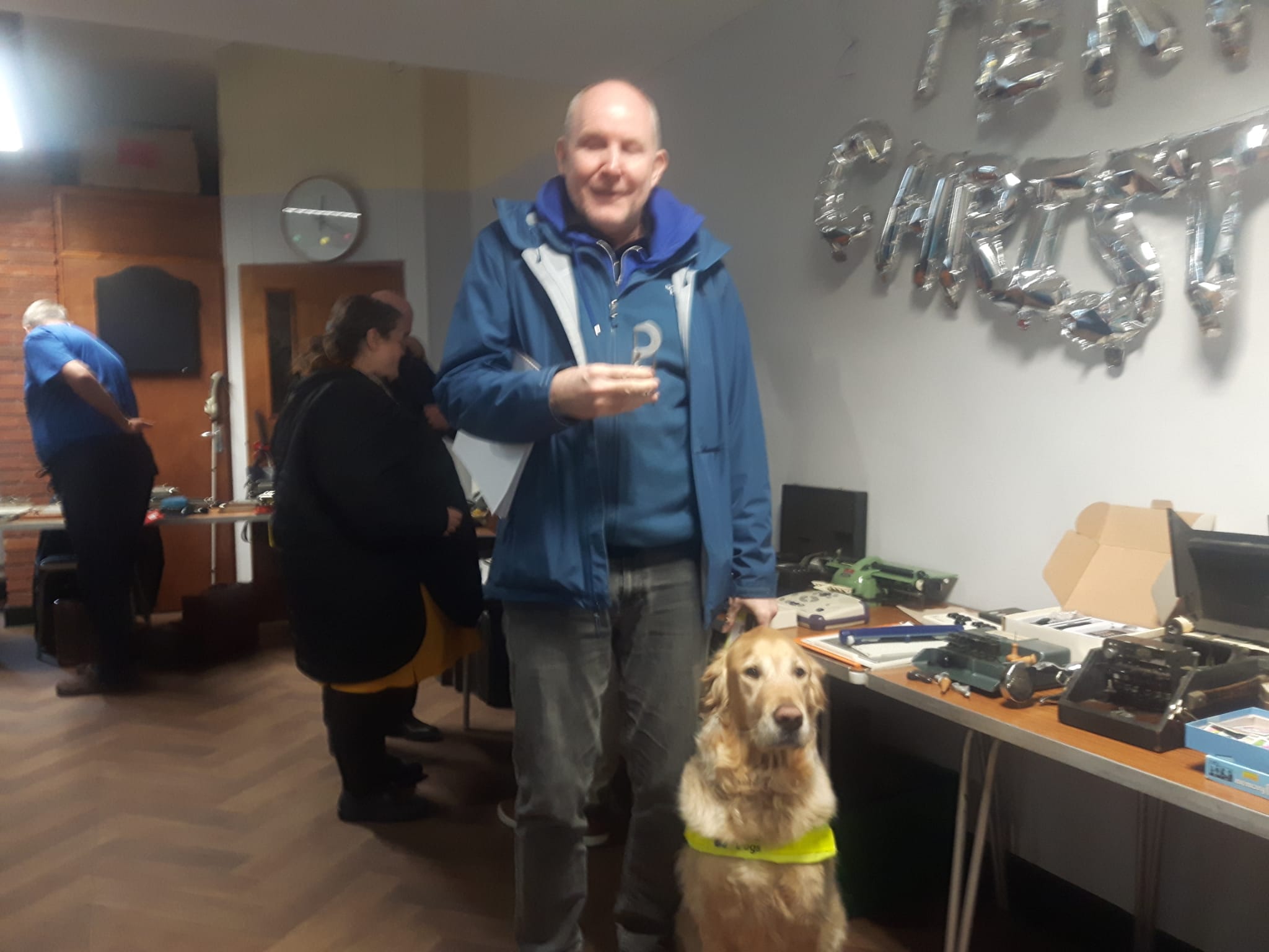 Image of Paul with Pyrgo Holding A Vintage Braille Measuring Device At The Braillests World Braille Day Conference 2025 At New College Worcester