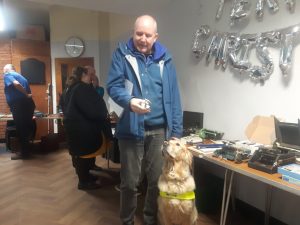 Image of Paul with Pyrgo Holding A Vintage Braille Measuring Device At The Braillests World Braille Day Conference 2025 At New College Worcester